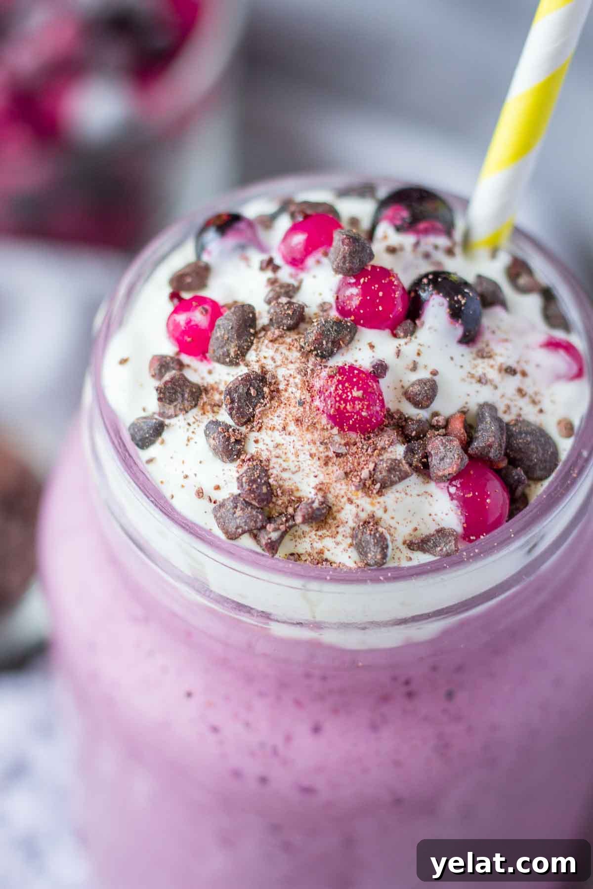 Creamy Mixed Berry Smoothie Recipe for Energy and Taste 7 Close view of frozen berry smoothie topped with cream