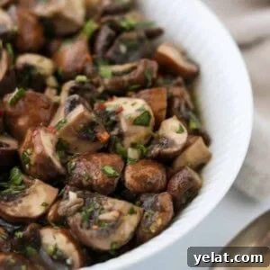 Quick Pickled Mushrooms: Fast Tangy Recipe for Snacks and Sides 10 Close up of Easy Quick Pickled Mushrooms in a white bowl.