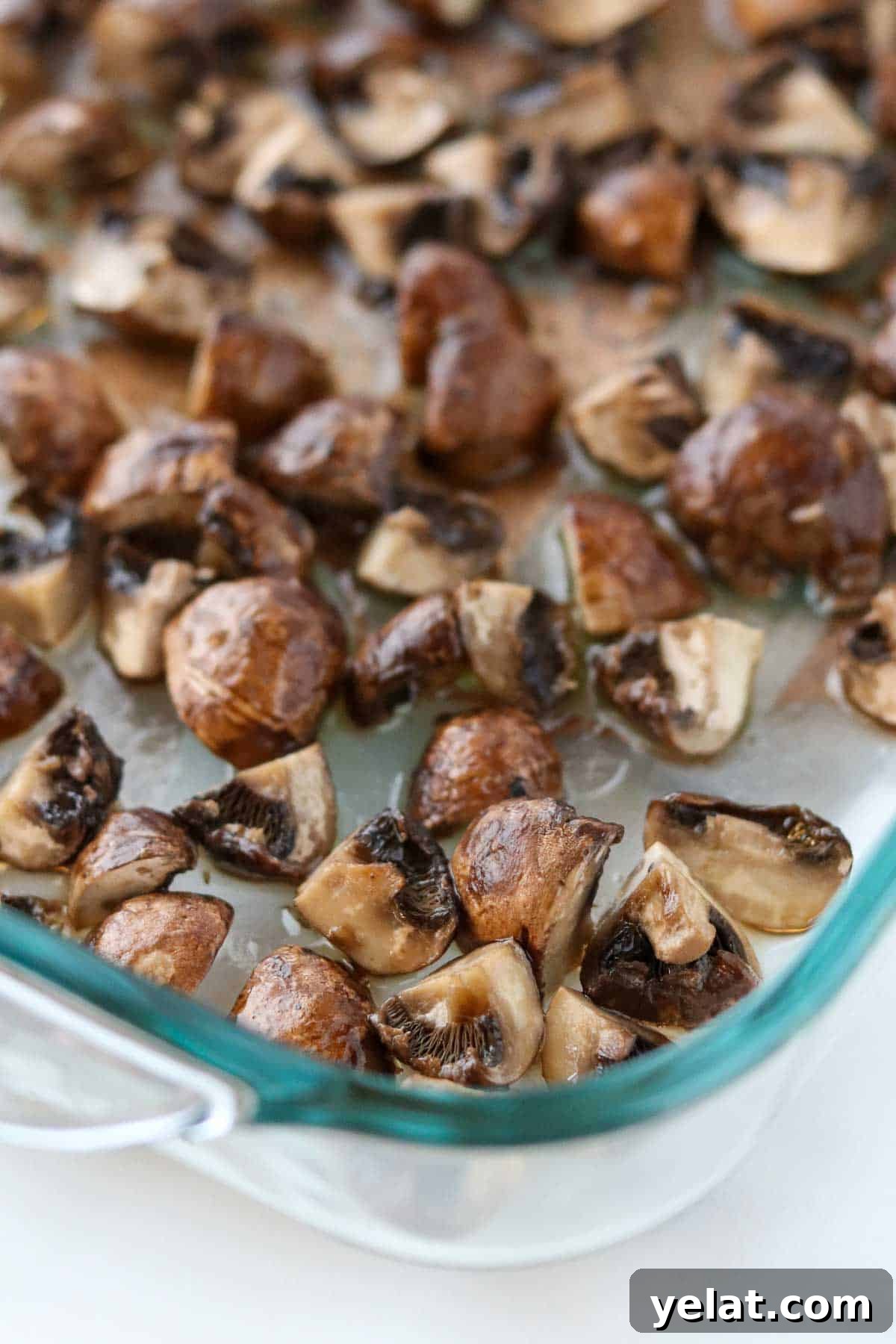 Quick Pickled Mushrooms: Fast Tangy Recipe for Snacks and Sides 5 Roasted mushrooms in a glass baking dish.