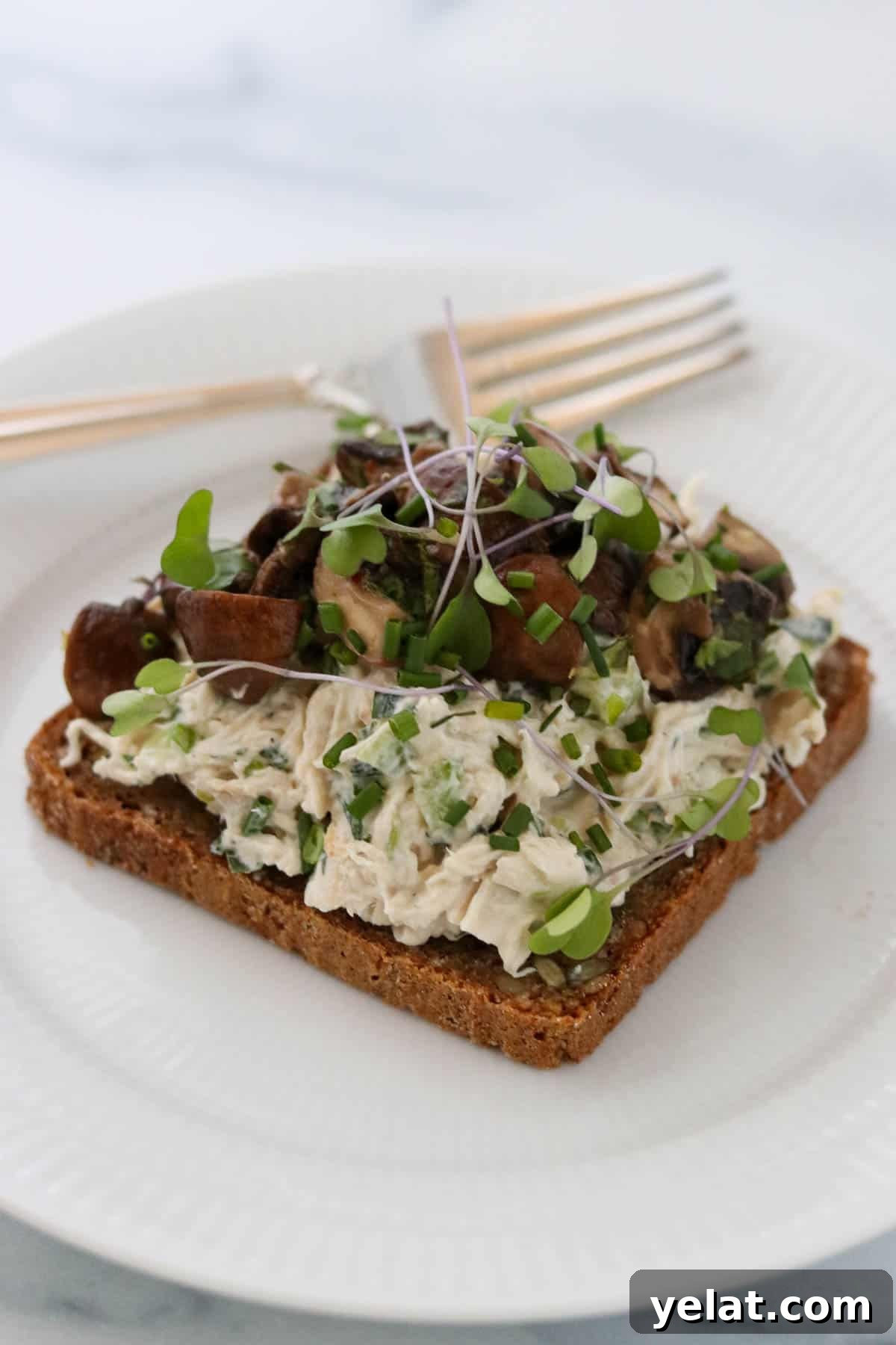 Quick Pickled Mushrooms: Fast Tangy Recipe for Snacks and Sides 9 Quick pickled mushrooms on top of a chicken salad sandwich.