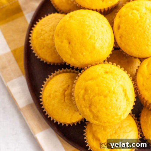 3 ingredient pumpkin muffins recipe stacked on pan